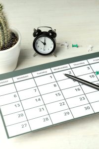 Concept of event planning and work planning on white wooden table